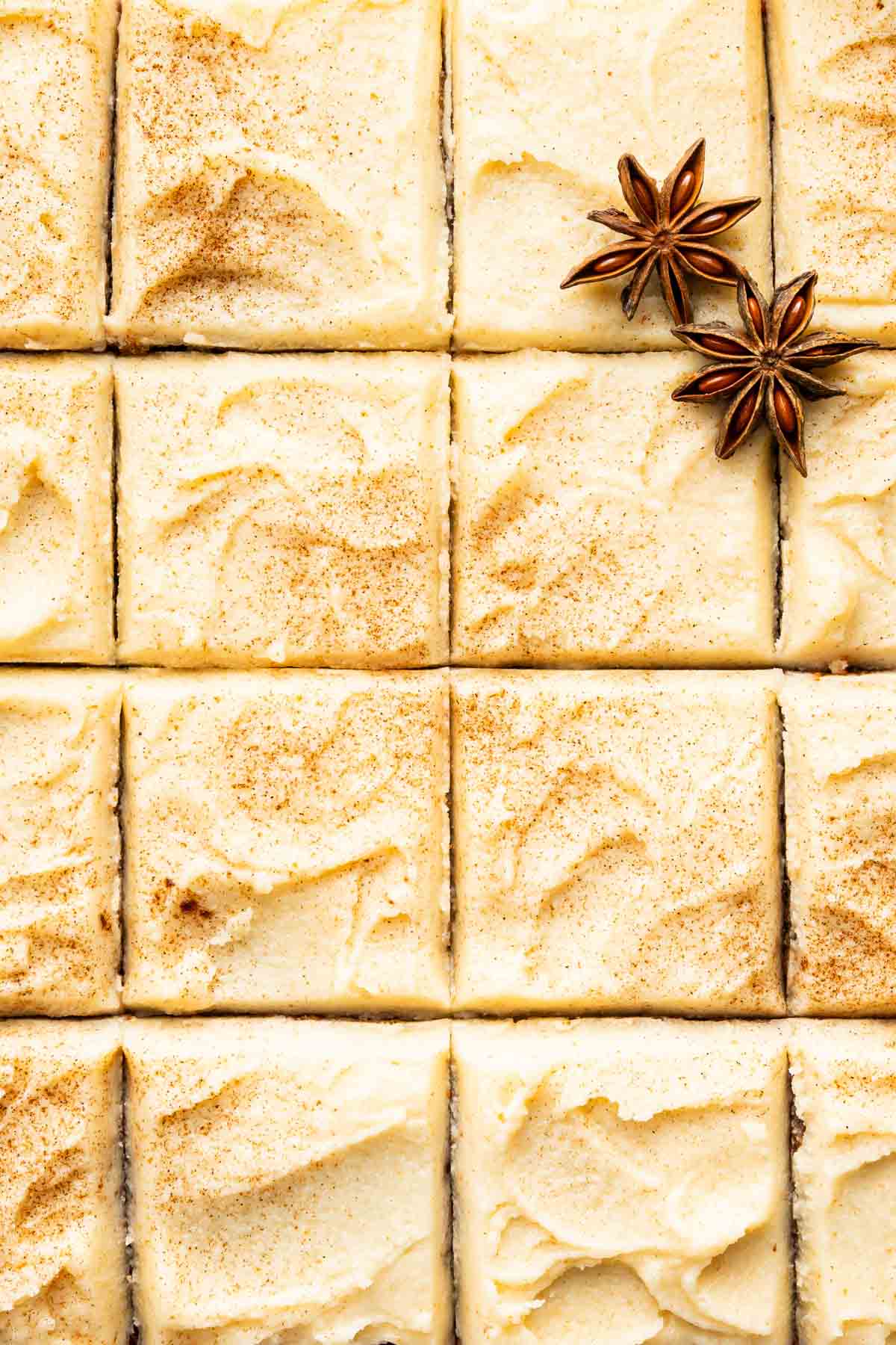 Square applesauce cake cut into 16 equal pieces.