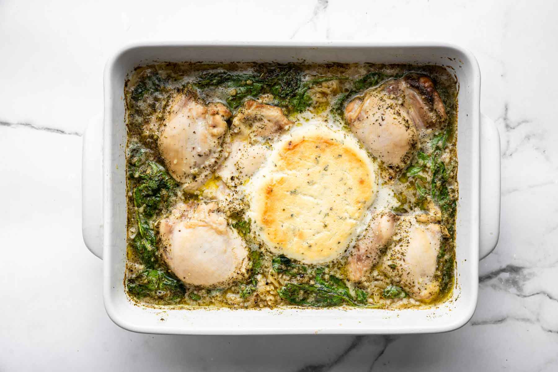 Chicken Orzo Bake in a white rectangular dish with Boursin cheese.