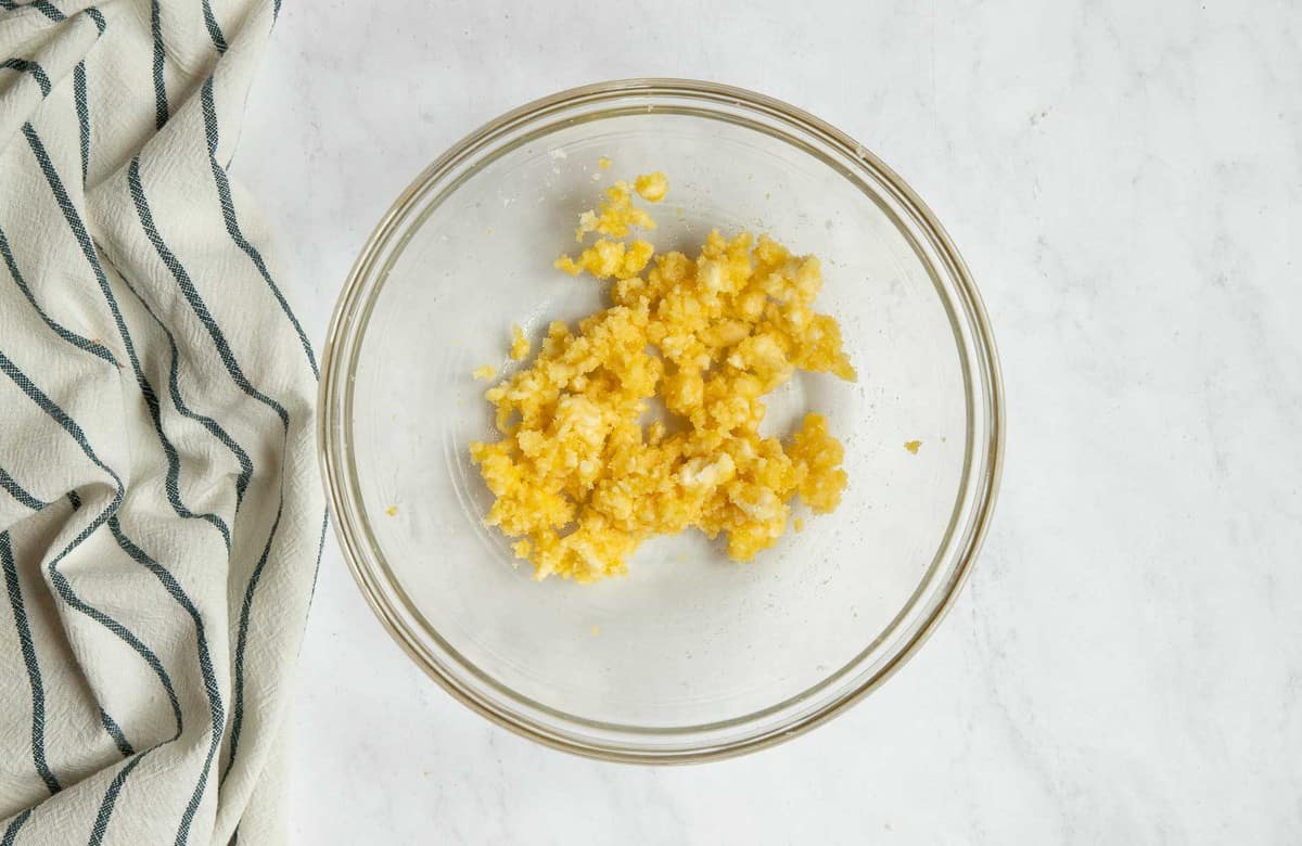 Bowl of bright yellow cookie dough enriched with egg yolks.