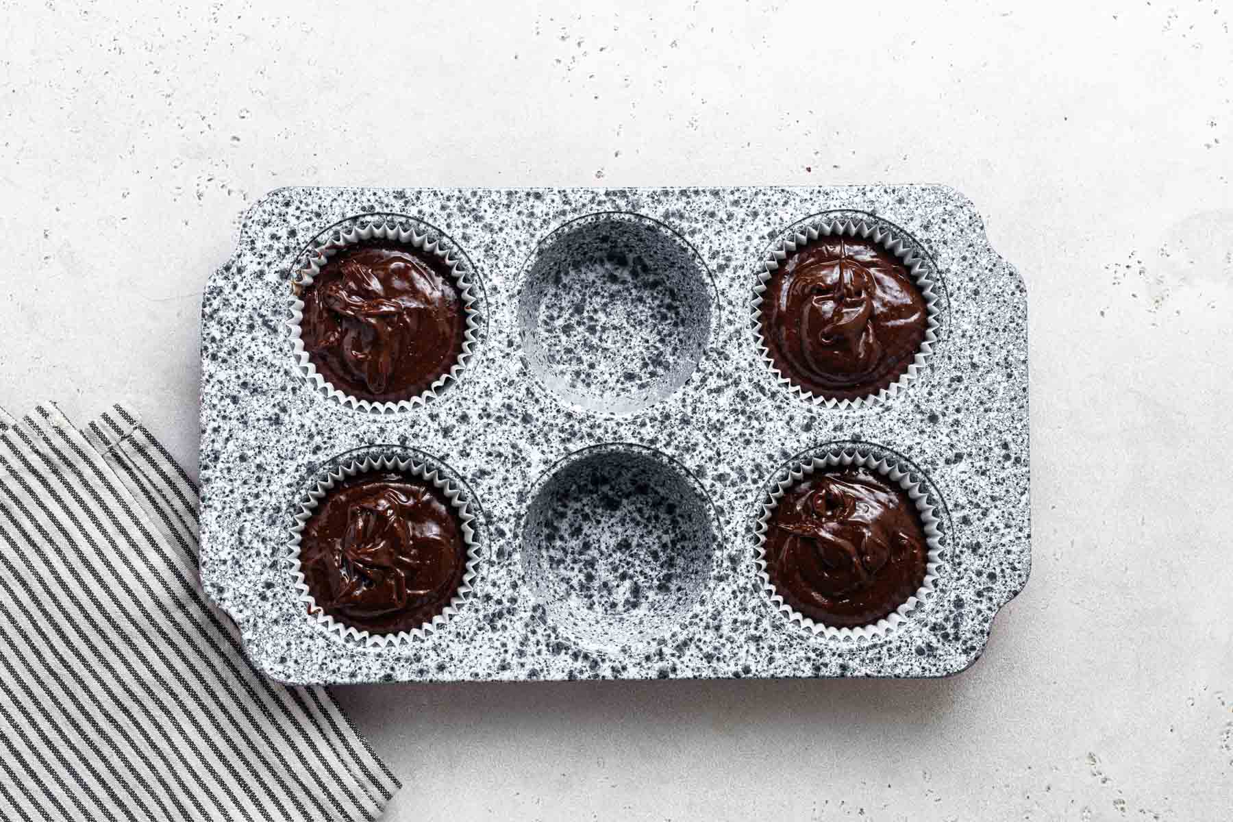 Small cupcake pan with 4 holes filled.