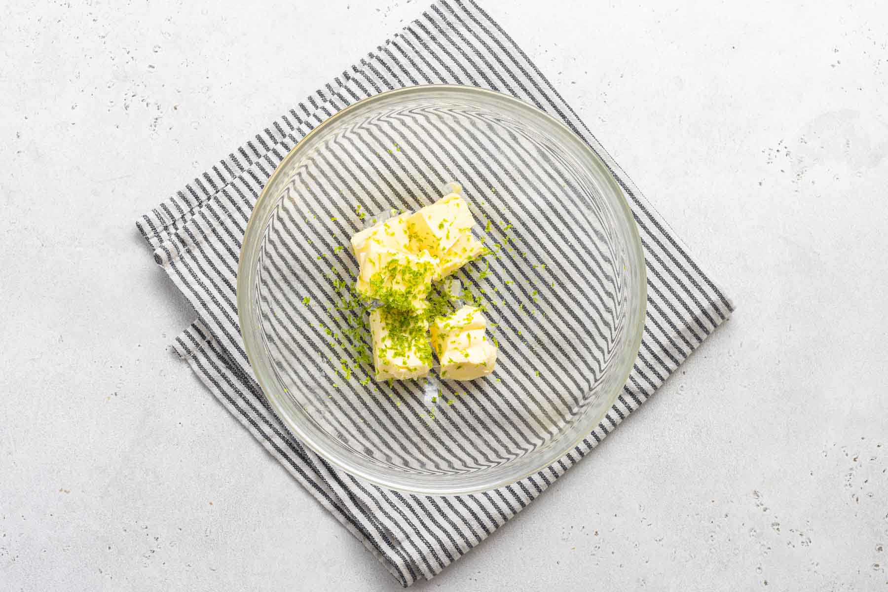 Lime and butter in clear bowl.