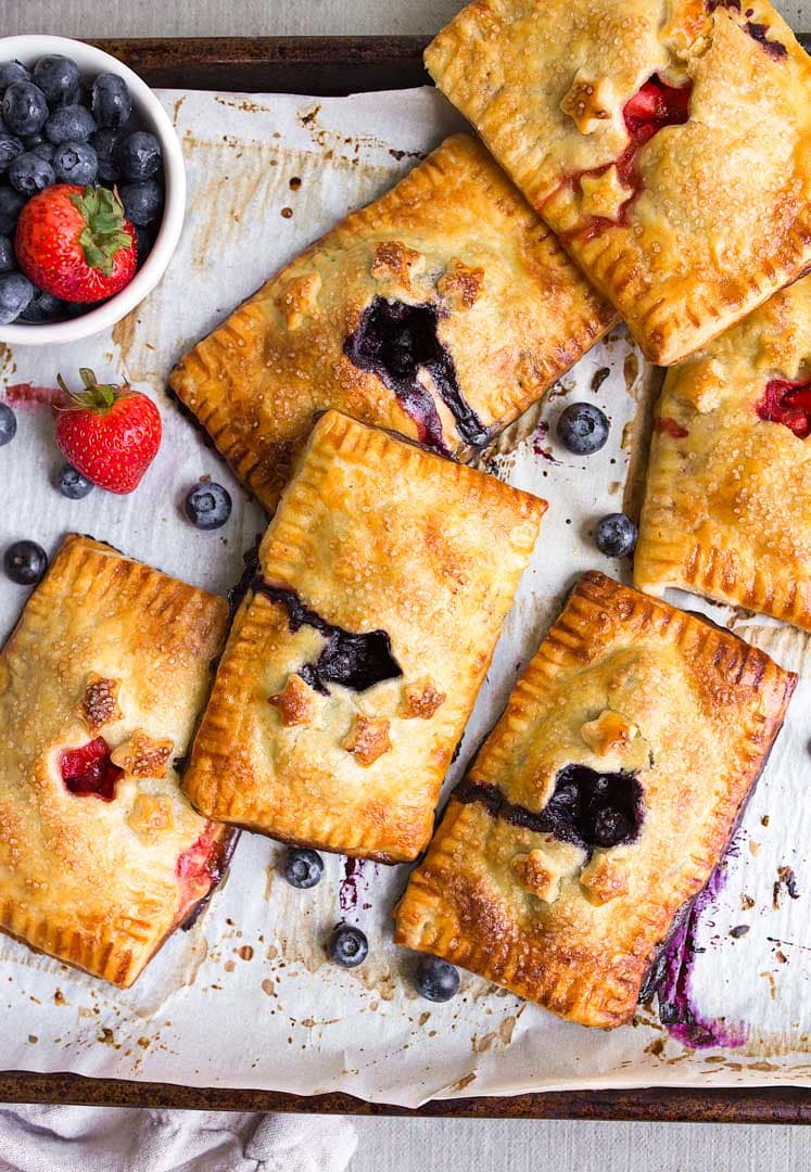 Blueberry Hand Pies Recipe: a mini blueberry pie you can hold in your hand. The best hand pie recipe.