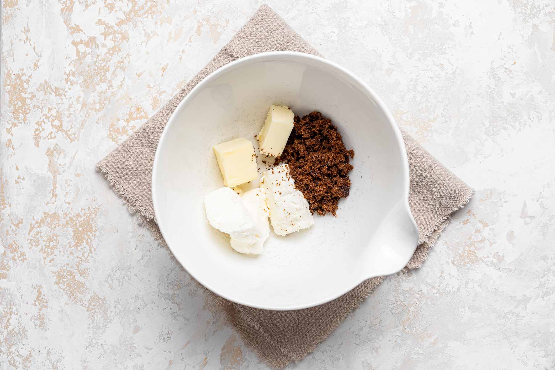 Brown sugar, cream cheese, and butter in mixing bowl.