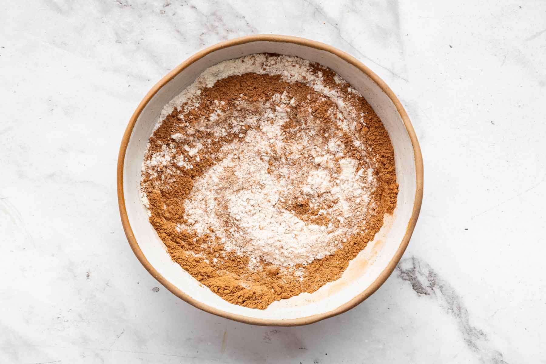 Cocoa powder and flour in a bowl.