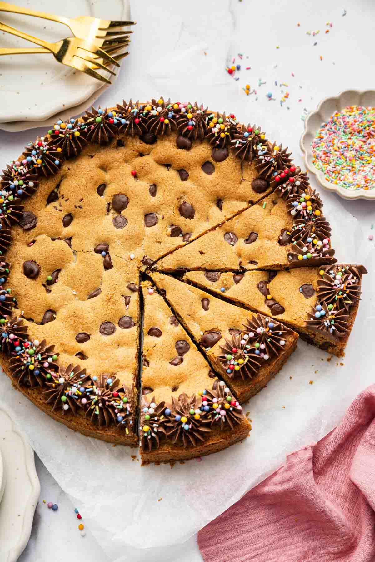 Cookie cake with chocolate chips, sliced for serving.