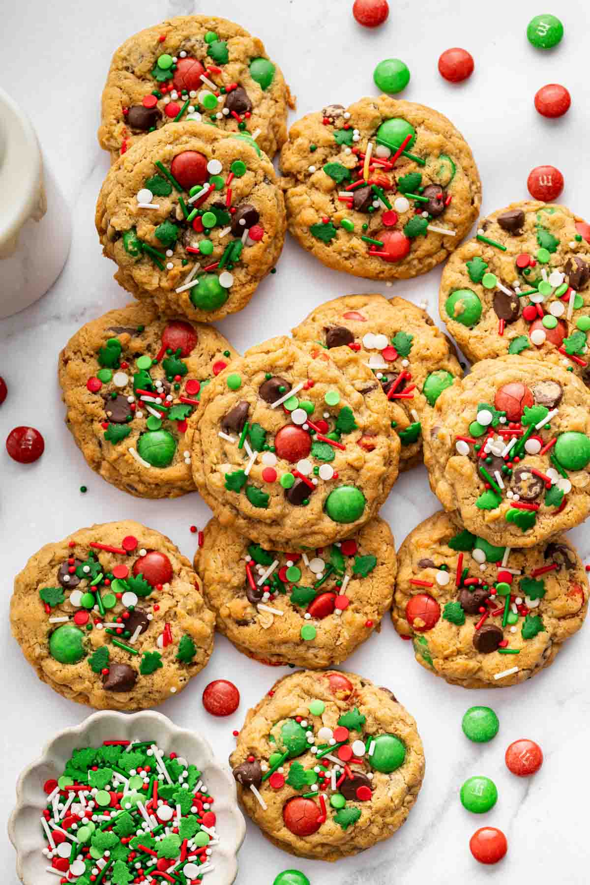 Vertical image of colorful red and green Christmas monster cookies.