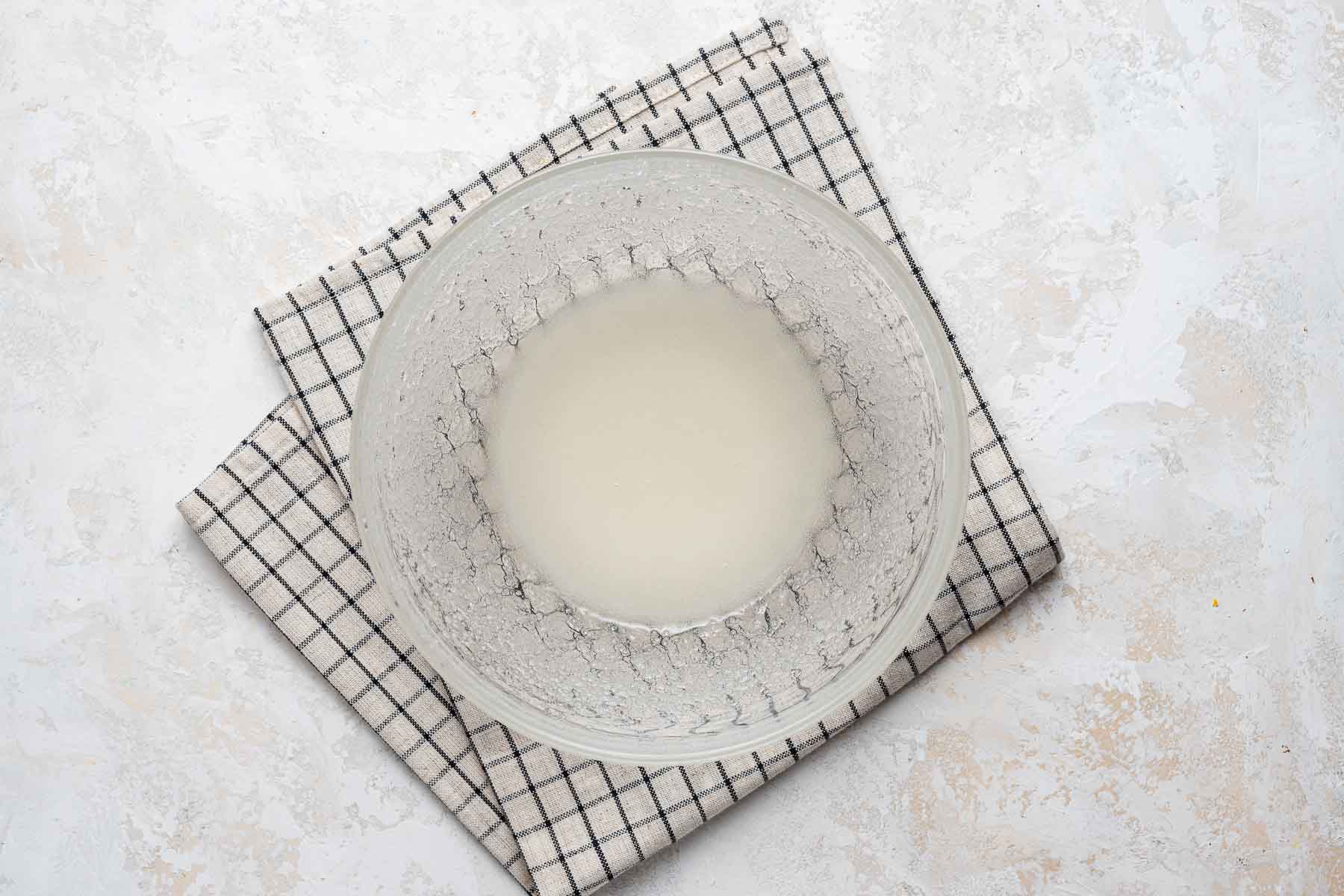 Oil and sugar, mixed together in a bowl.