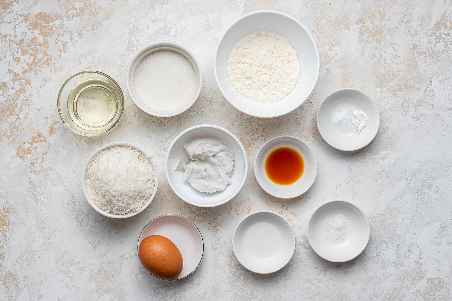 Coconut cupcakes ingredients on table.