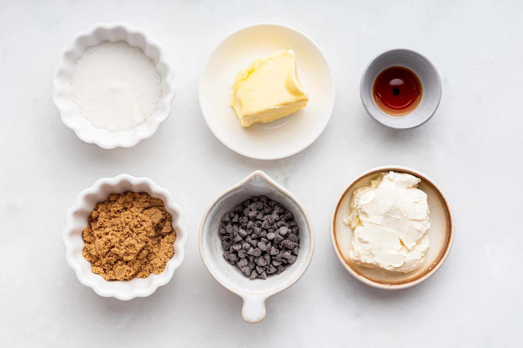 Small bowls with brown sugar, chocolate chips, and butter.