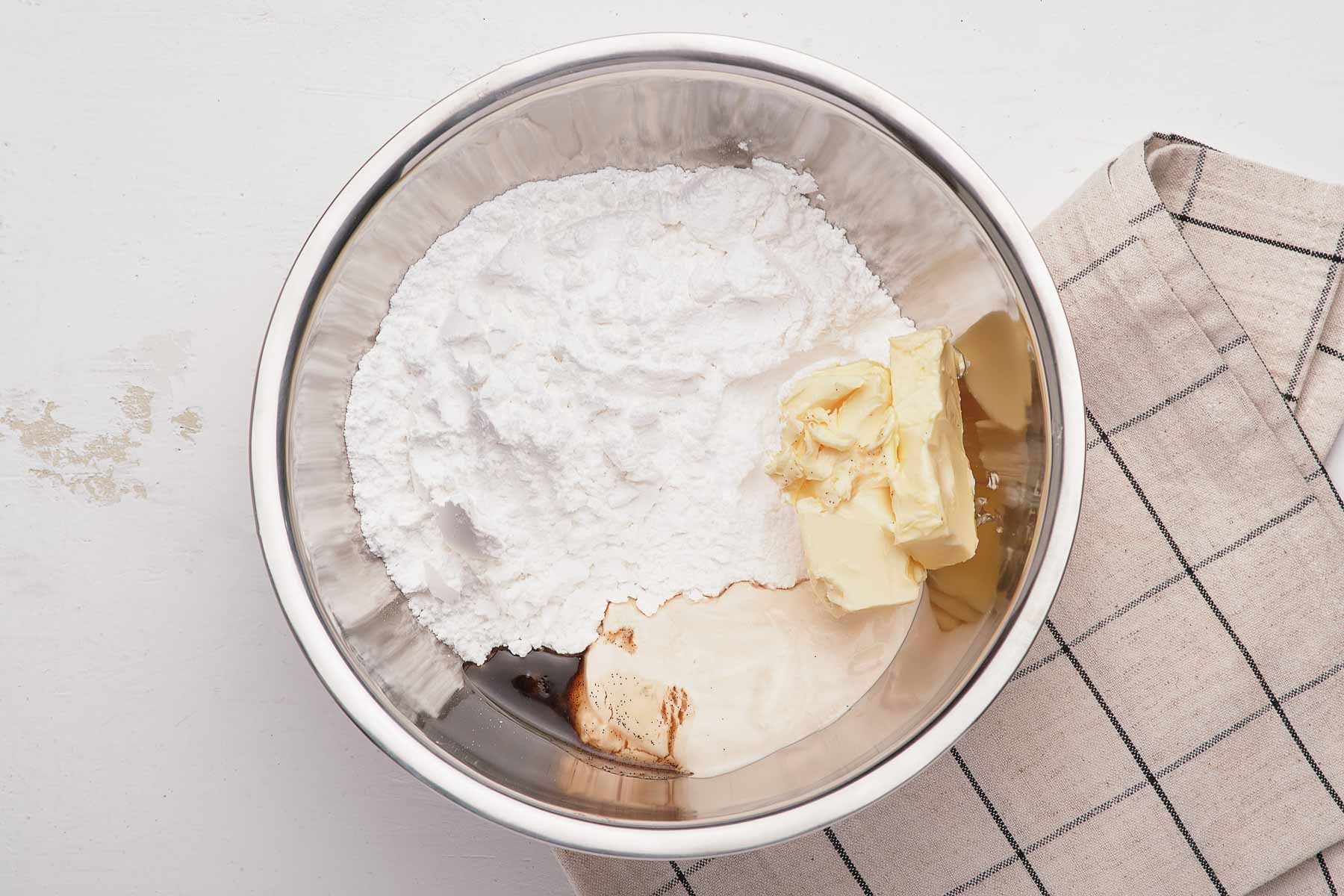 Frosting ingredients in a silver bowl.