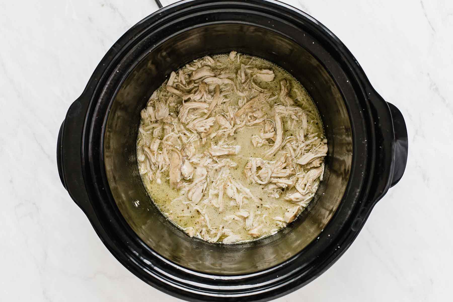 Creamy chicken breasts in crockpot.