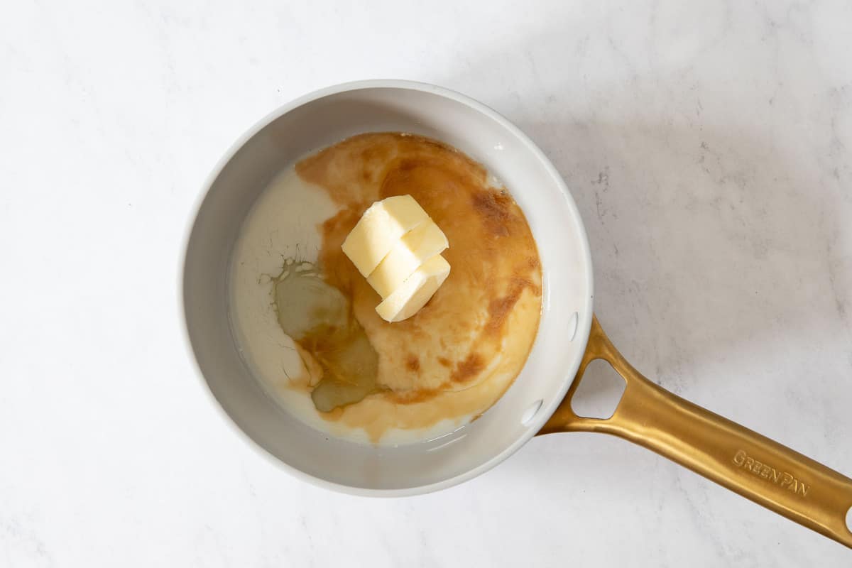 Small saucepan with butter, egg white, milk and vanilla.