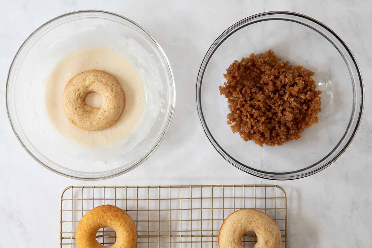 Bowls with donut glaze and crumb topping.