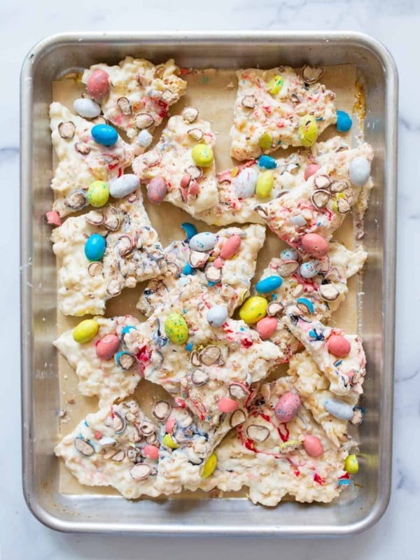 Overhead shot of colorful easter bark on silver tray.
