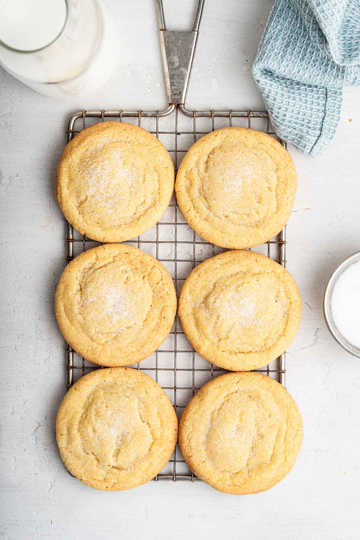 Six easy small batch sugar cookies on a wire rack, cooling.