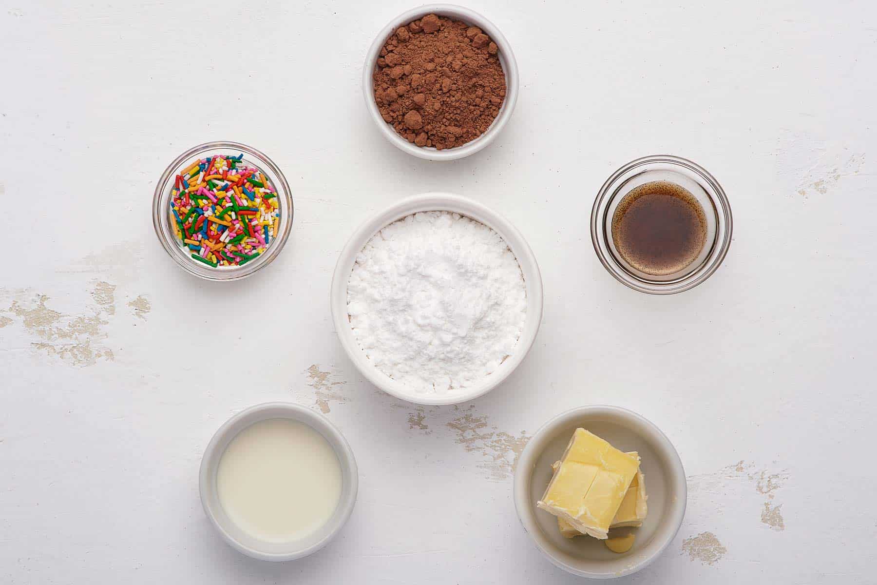 Ingredients for chocolate buttercream with sprinkles.