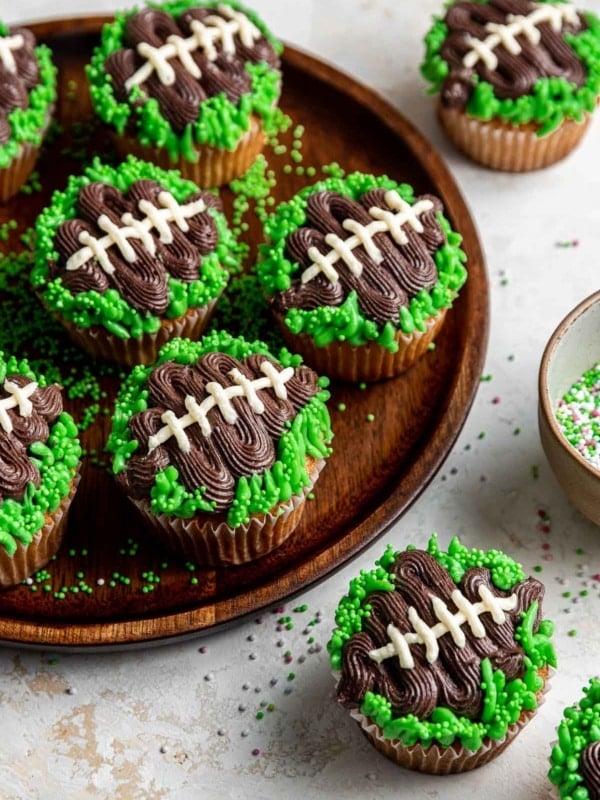 Football cupcakes with green grass.