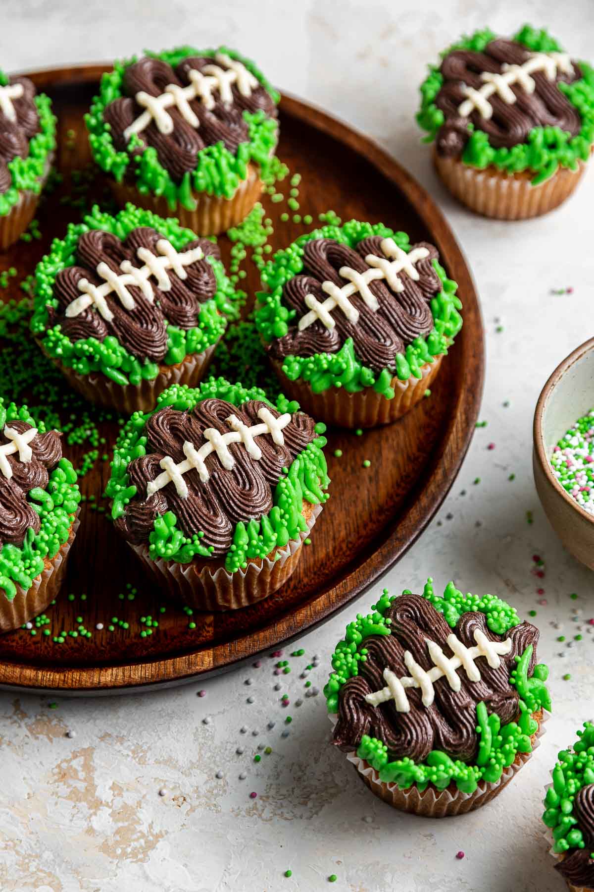 Football cupcakes with green grass.