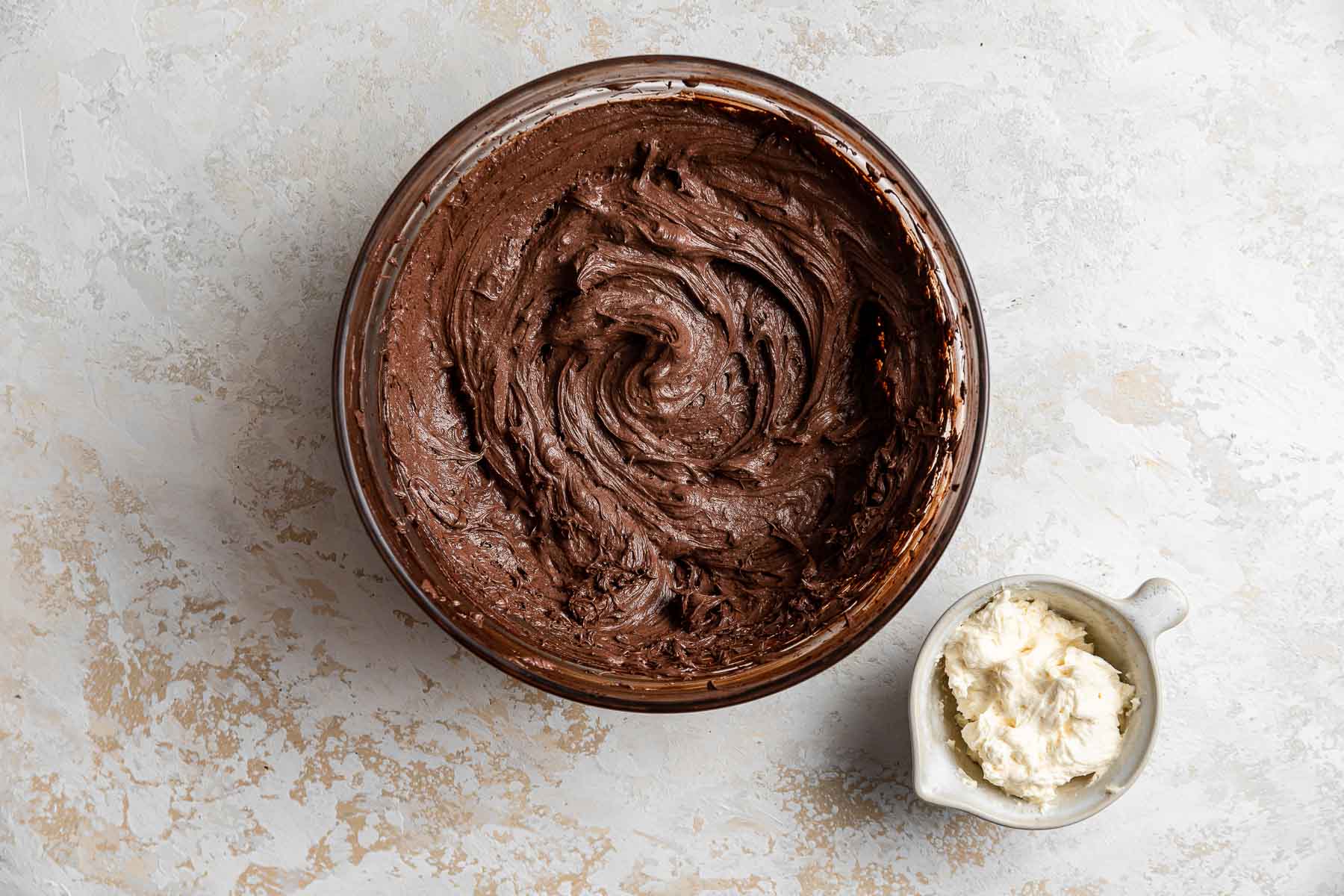 Chocolate and vanilla buttercream frosting side by side.