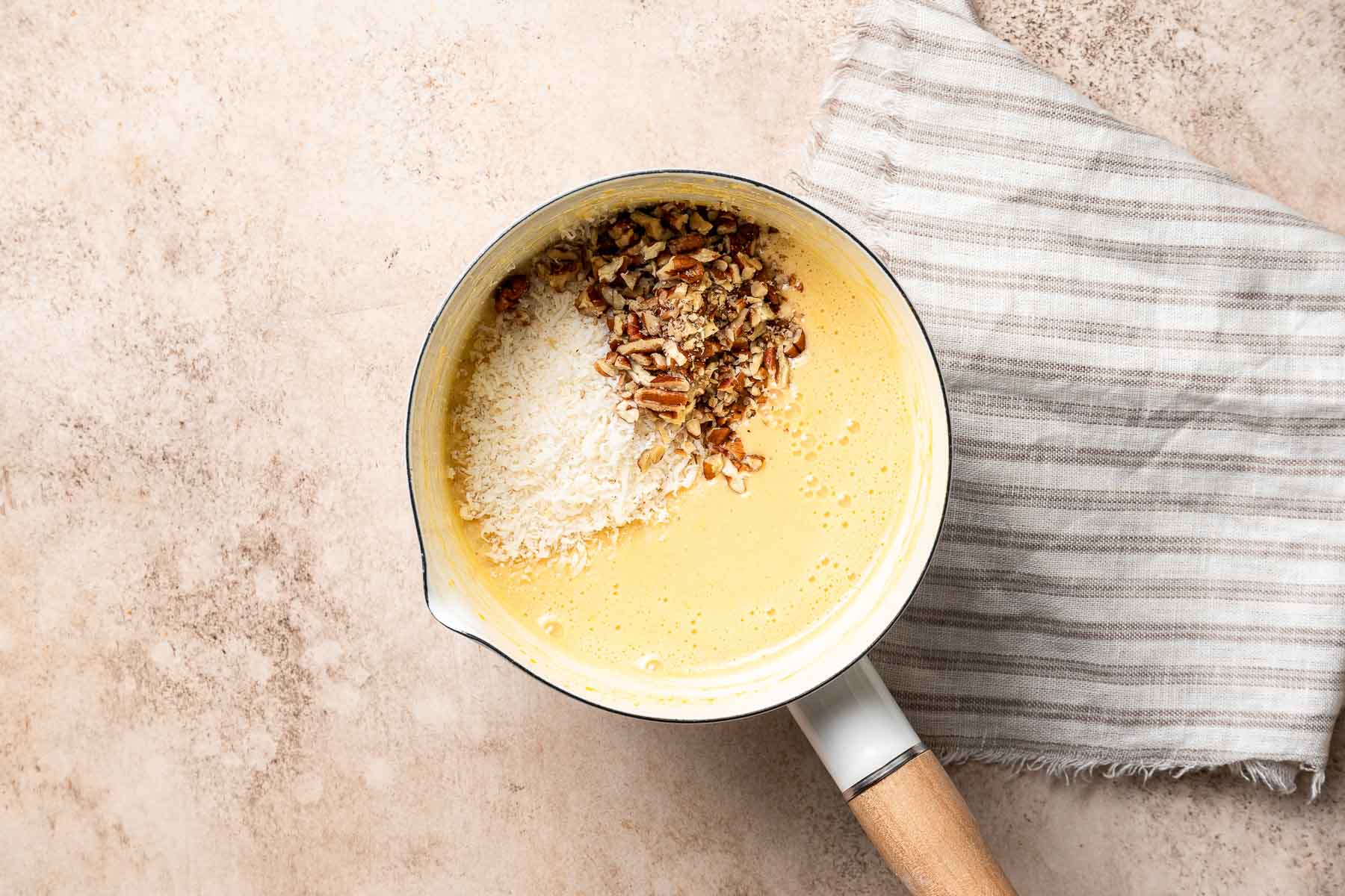 Coconut and pecans in German chocolate cupcake frosting.