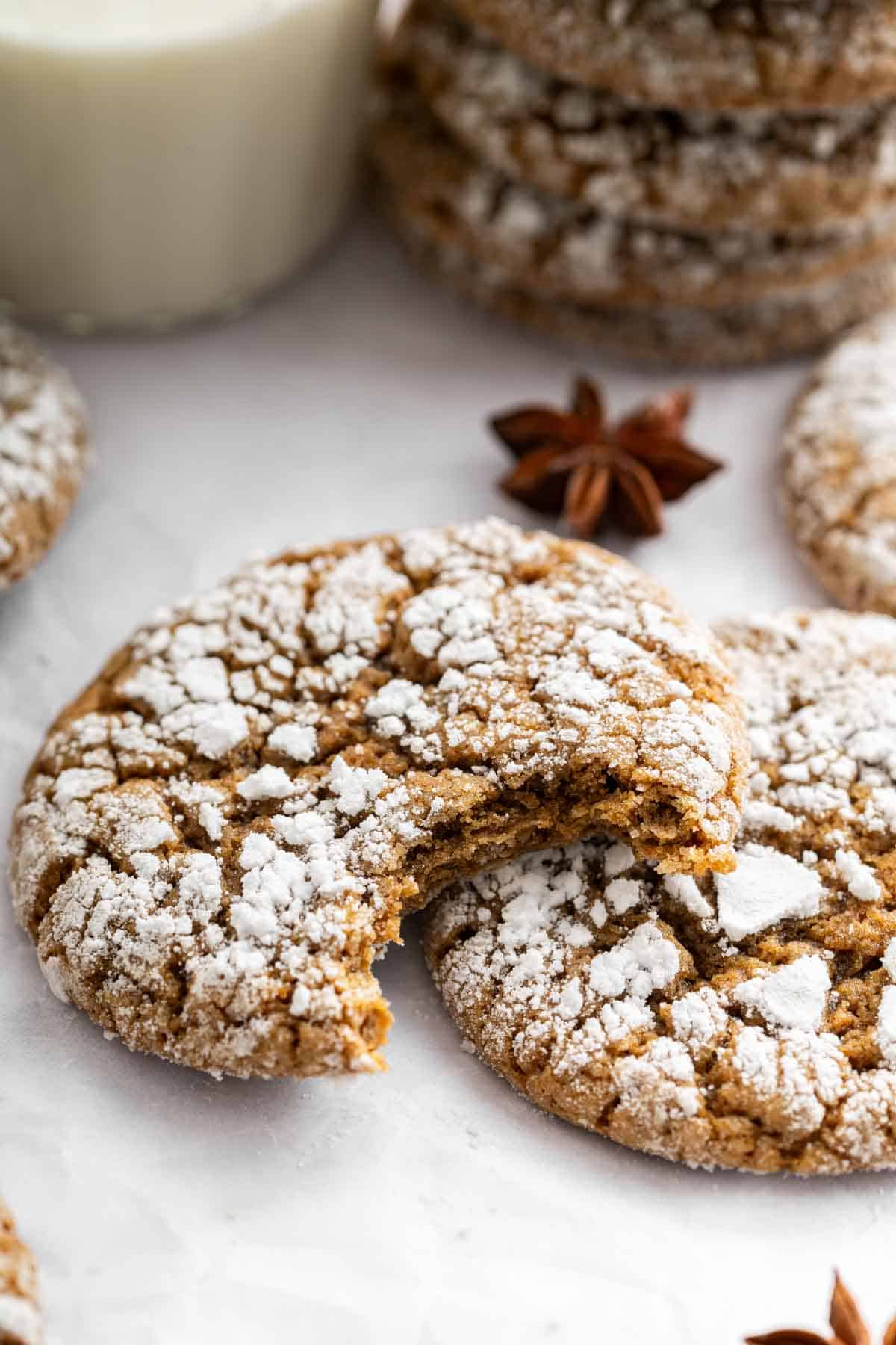 Two brown crackly treats with one bite missing from one.