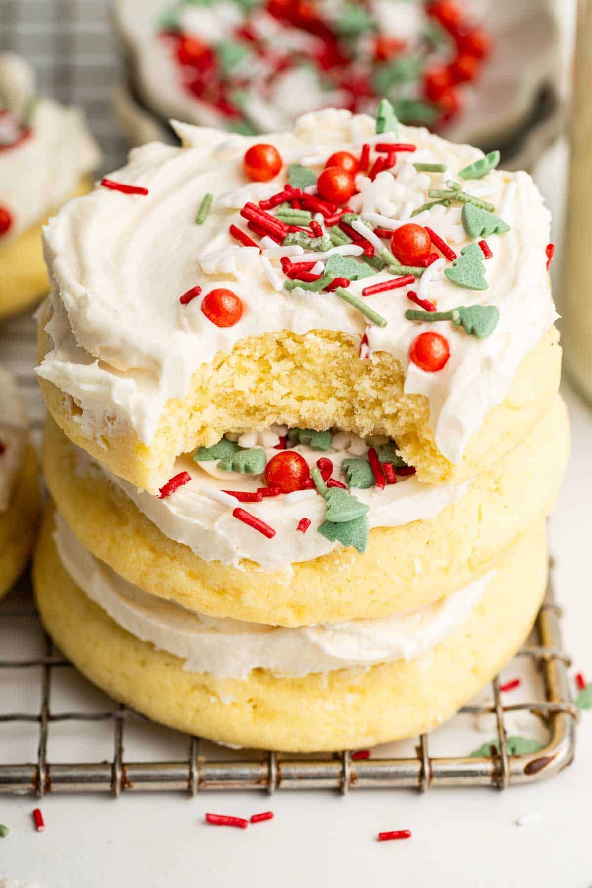 Stack of christmas cookies with lots of sprinkles.