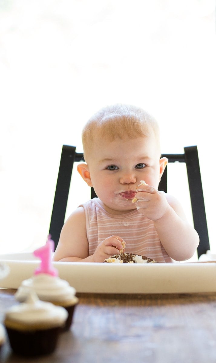 Baby's first birthday cake is sugar free! Maple syrup cupcakes with coconut whipped cream.