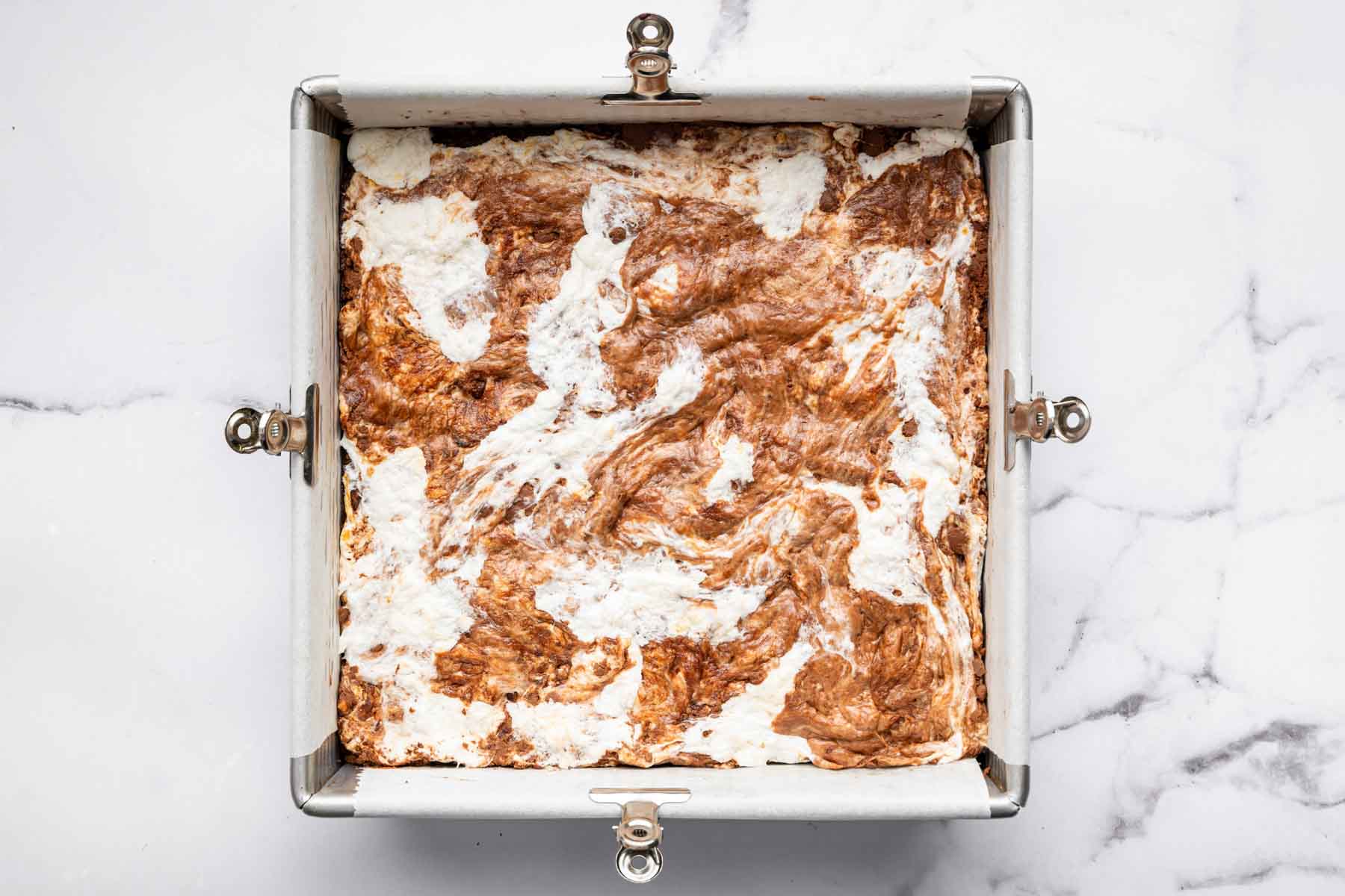 Square pan with marshmallow swirl brownies.