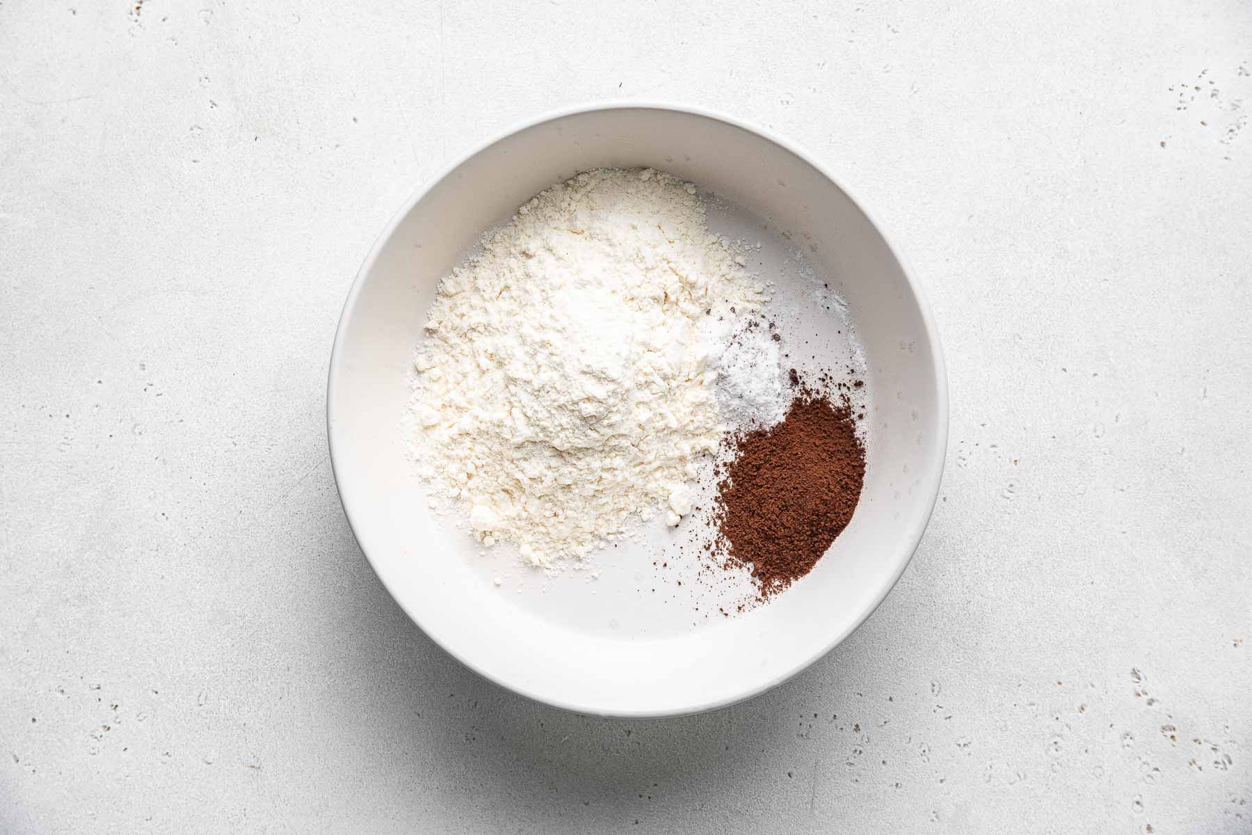 Dry ingredients for mocha cupcakes in bowl.