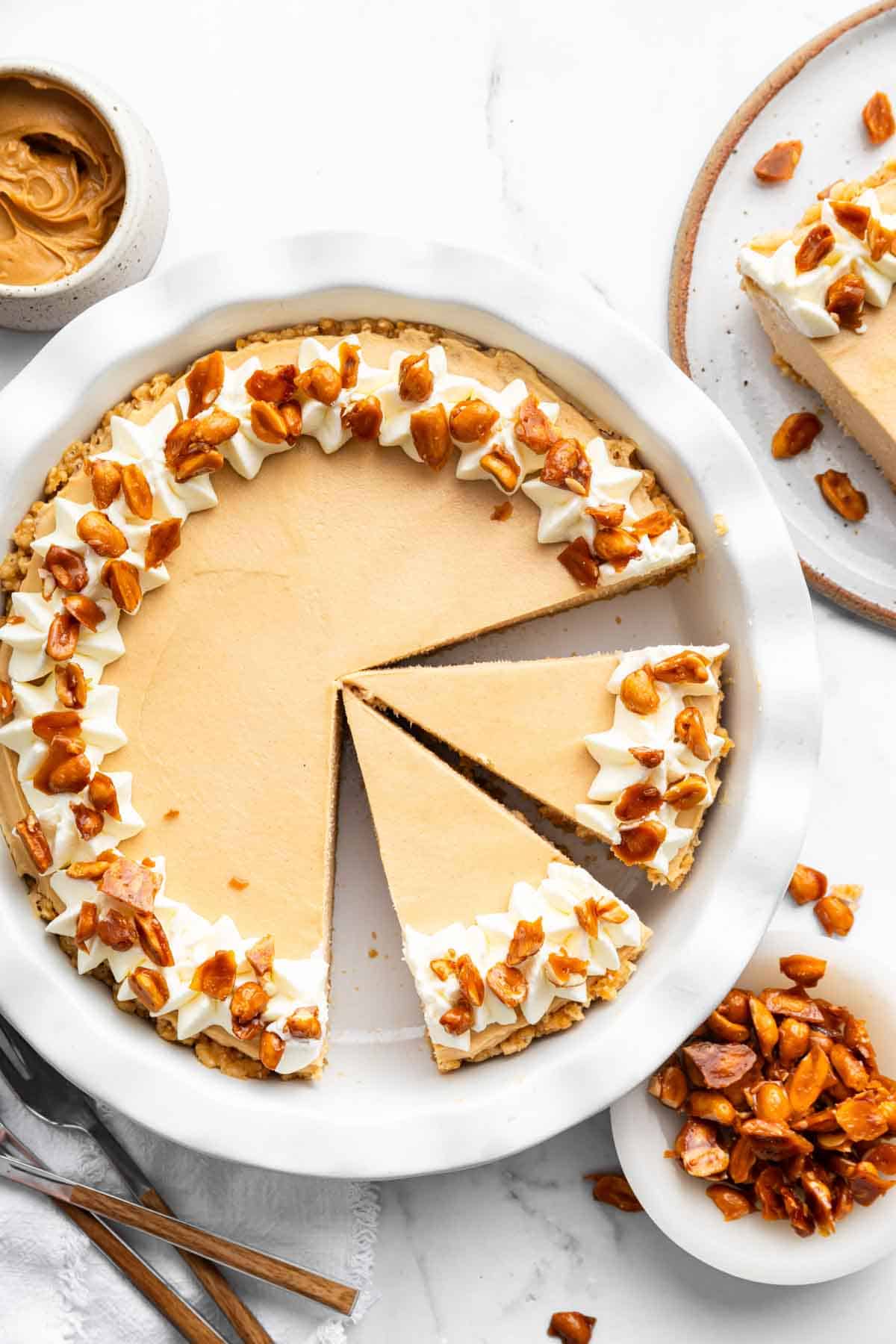 Overhead image of no bake peanut butter pie sliced into skinny pieces.