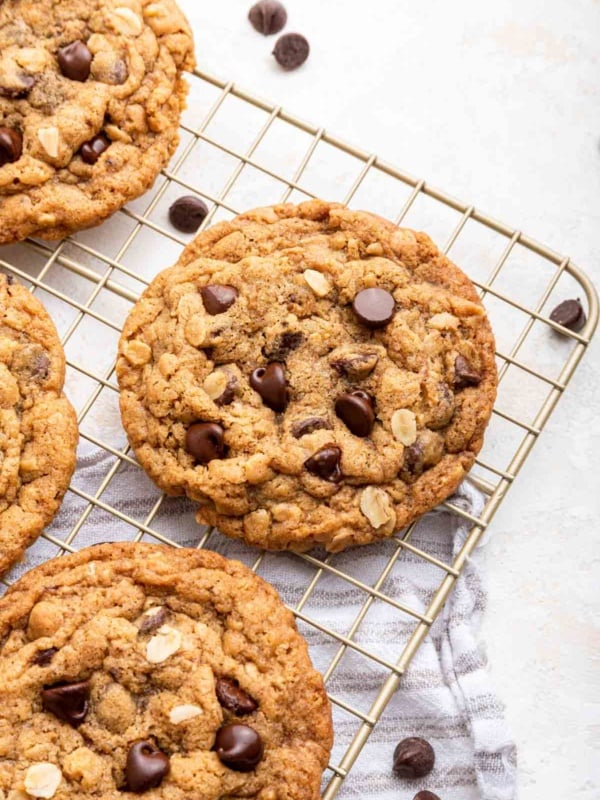 Oatmeal chocolate chip cookies on a wire rack.