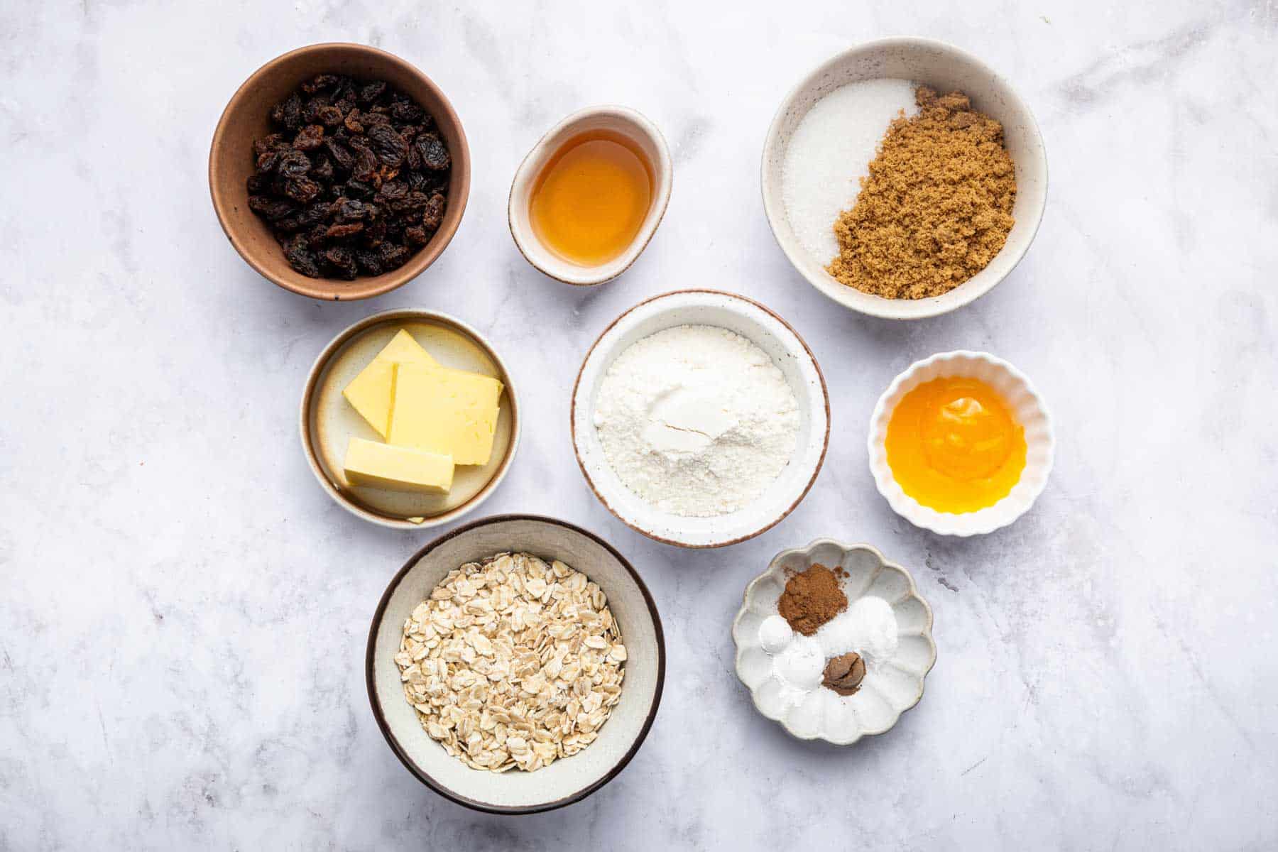 Bowl of oats, sugars, egg yolk, butter and rum.