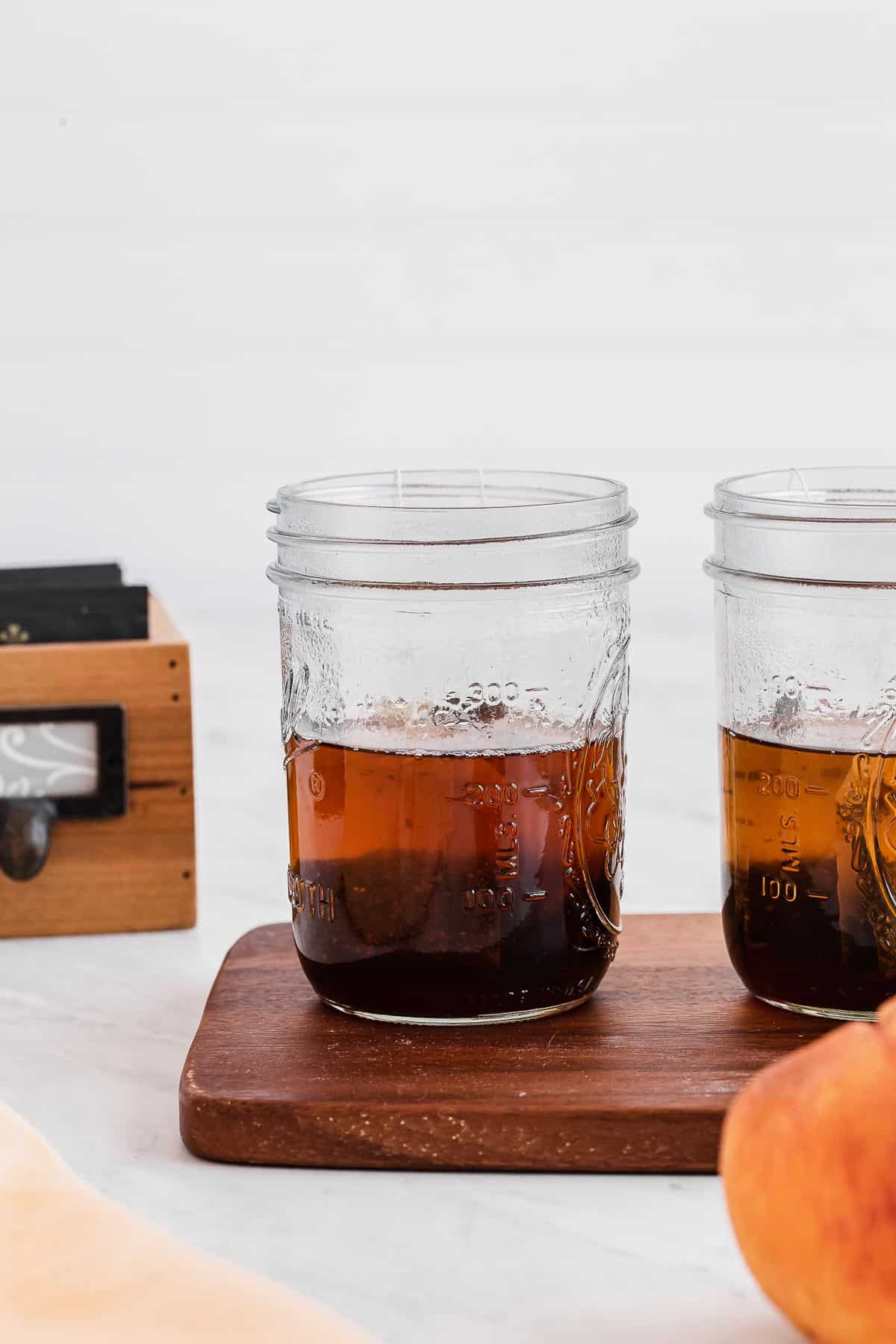 Black tea steeping in mason jars.