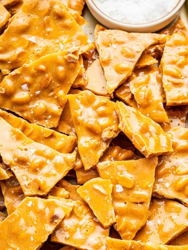 Macro image of peanut brittle broken into pieces.