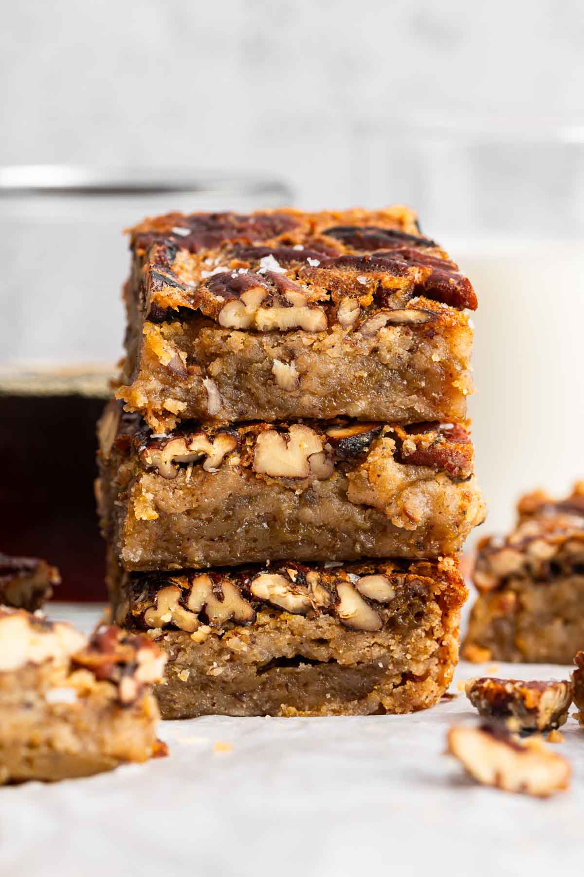 Stack of pecan pie bars on table.