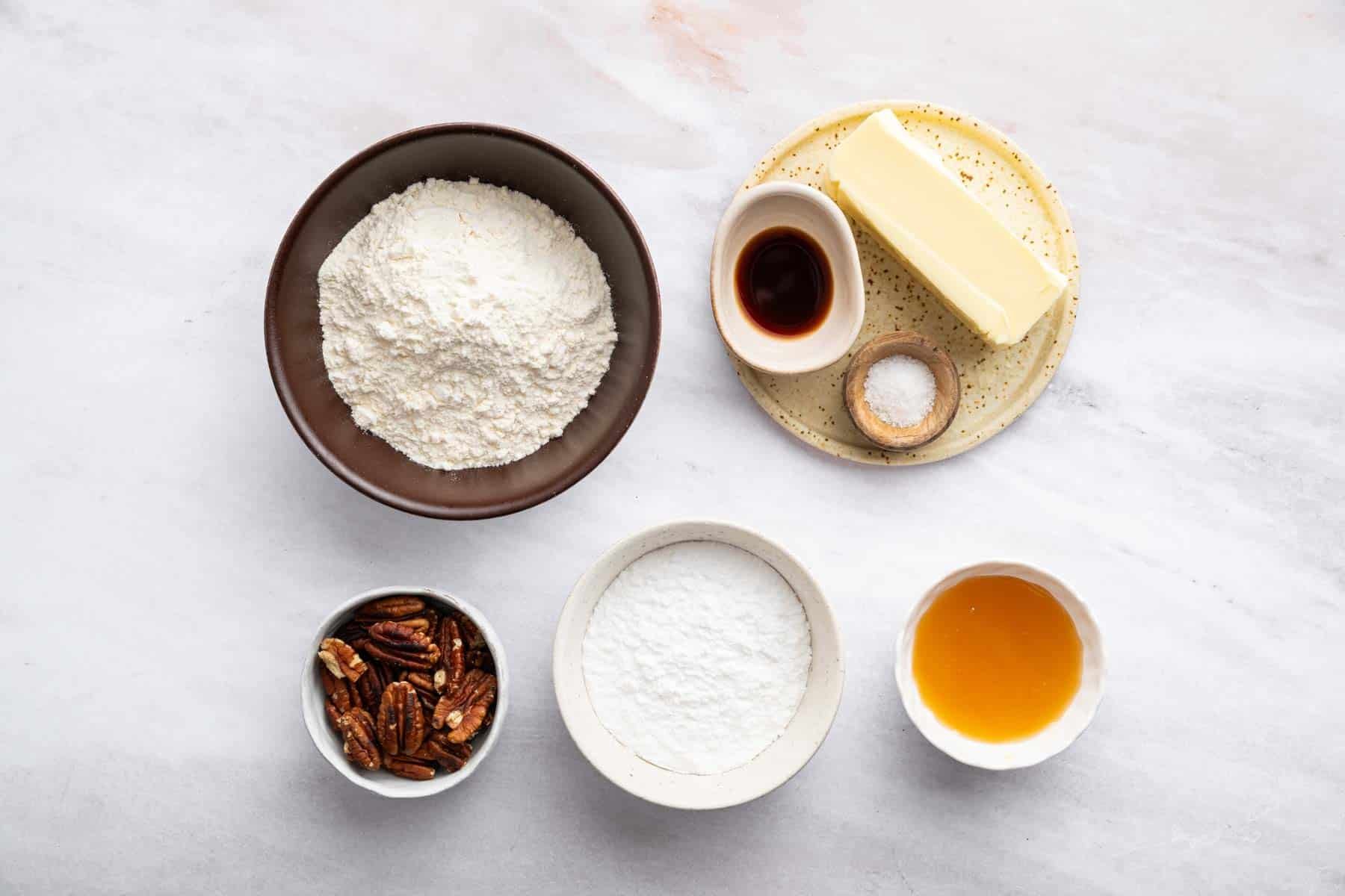 Bowl of flour, nuts, honey, and butter.