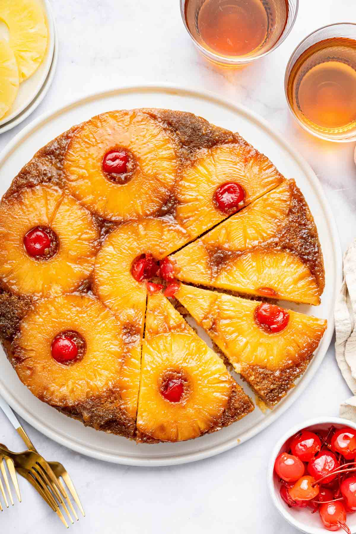 Overhead image of pineapple upside down cake sliced.