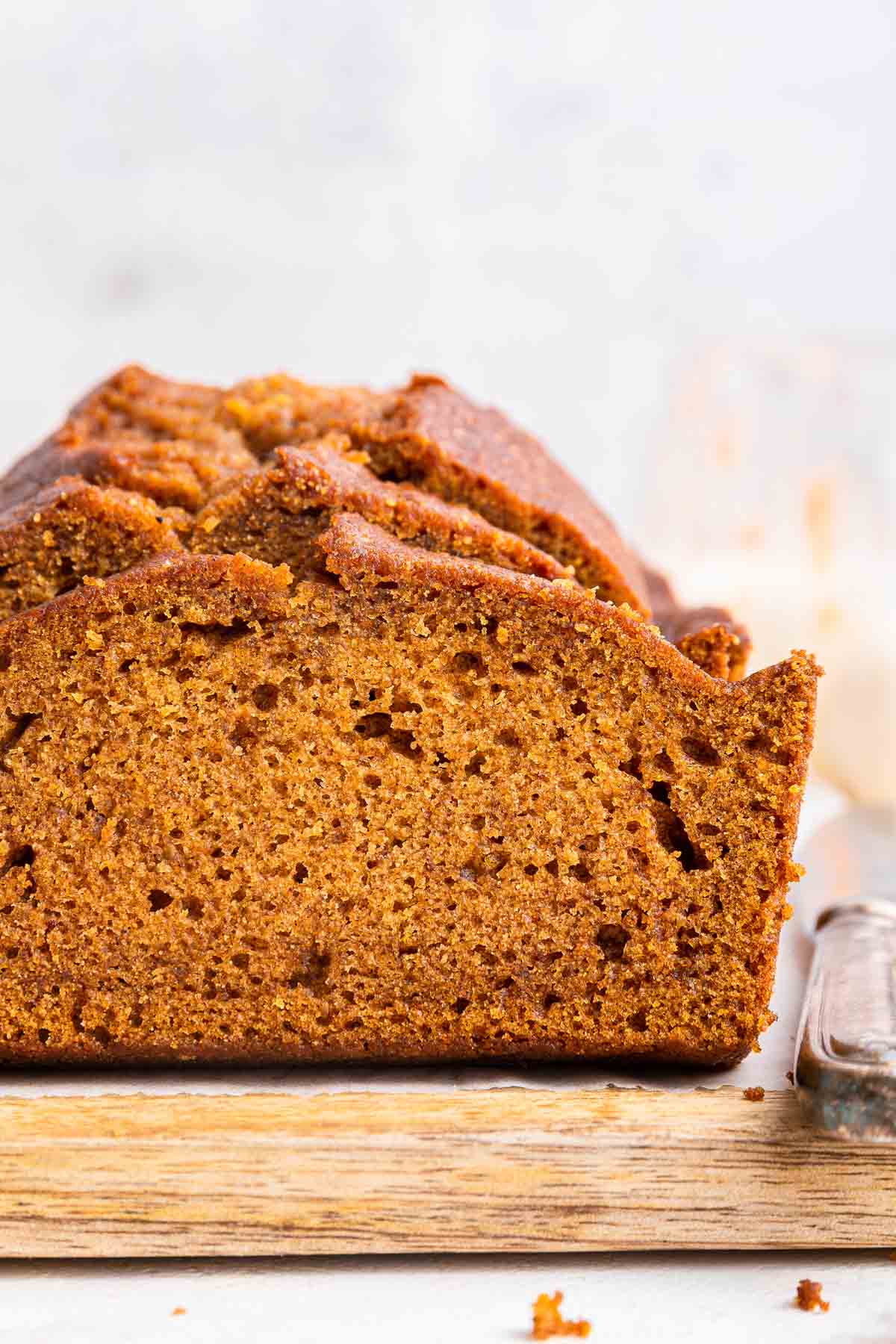 Macro, up-close shot of a slice of pumpkin bread.