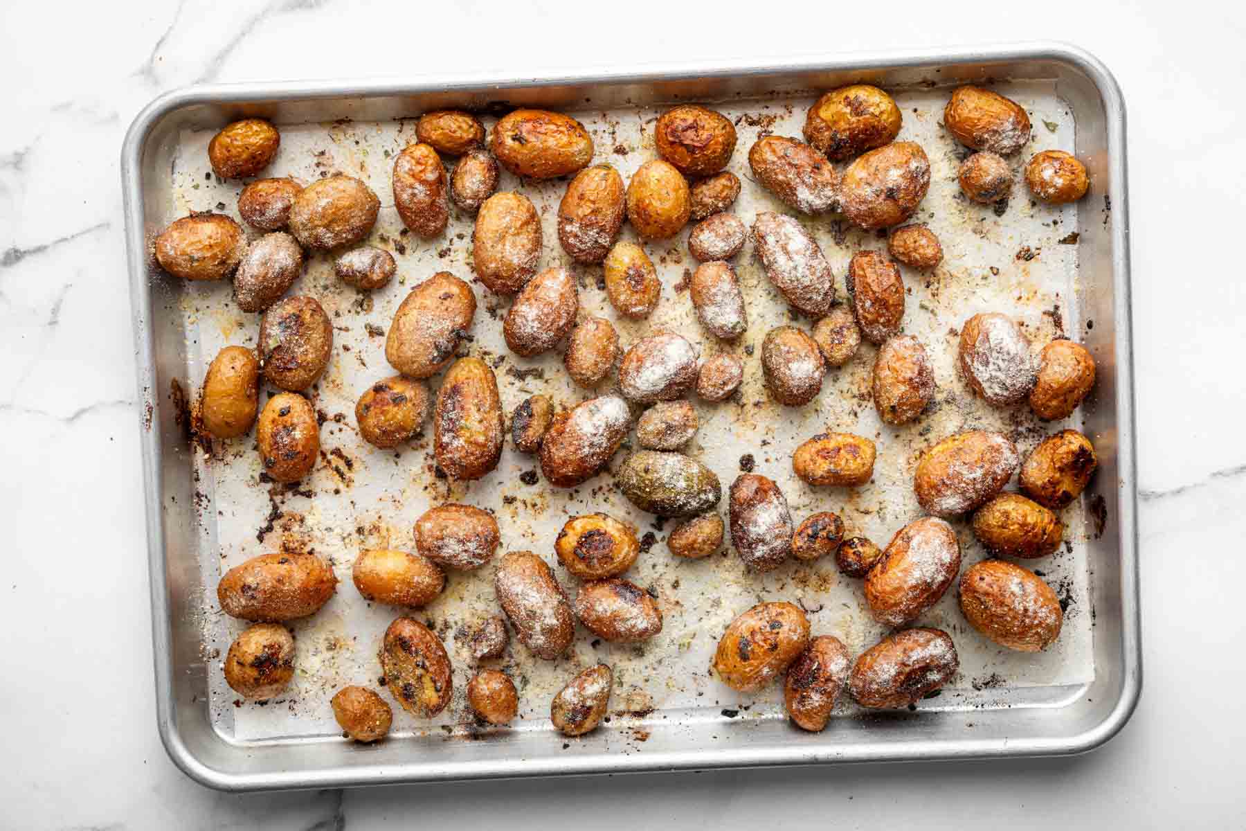 Roasted vegetables with white powder on top.