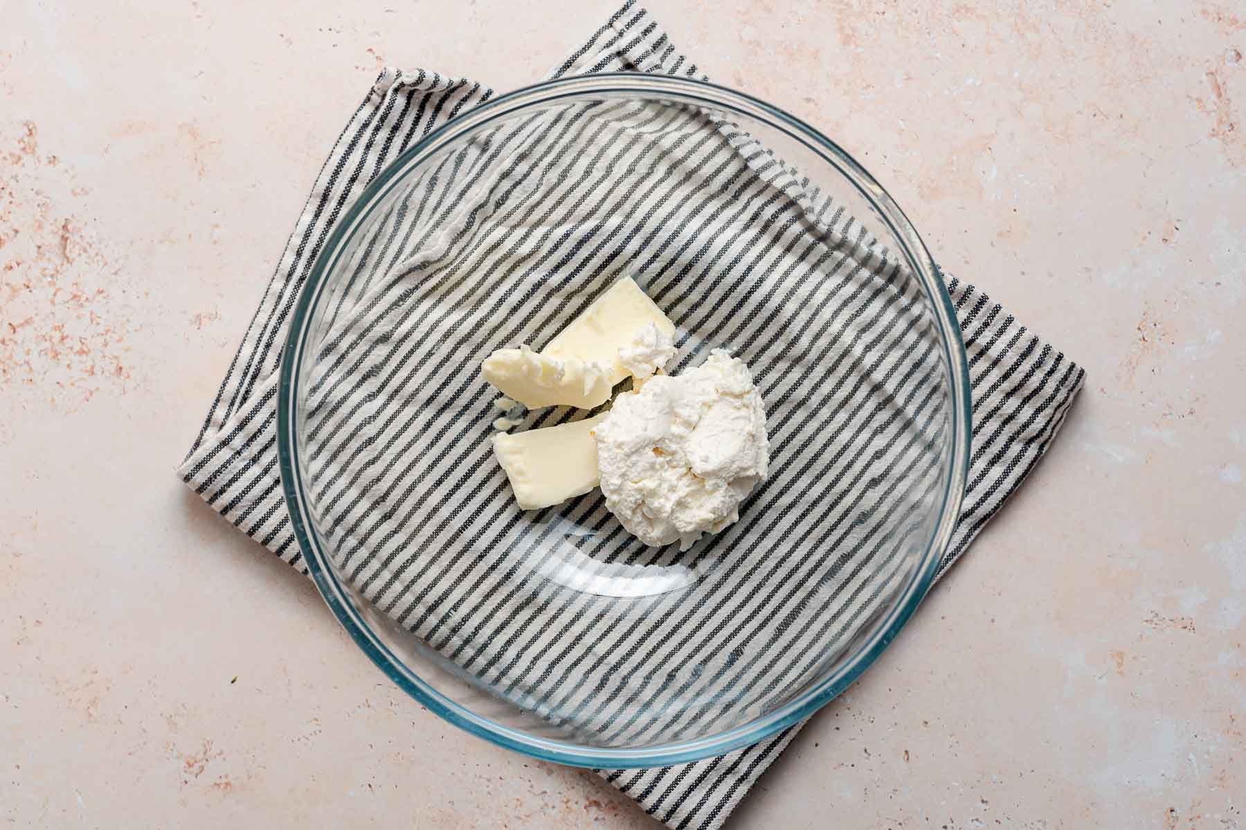 Ricotta and butter in glass bowl.