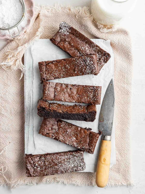 Small batch brownies for two, cut from a loaf pan with knife on side.