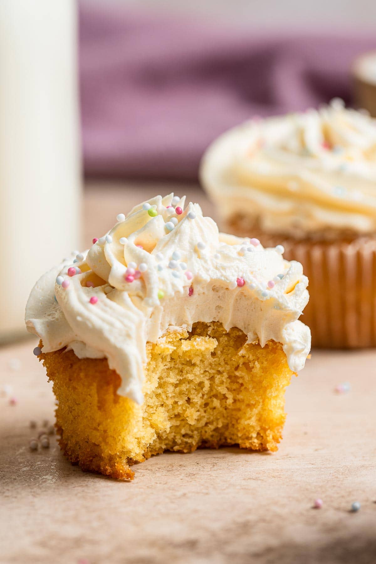 A cupcake with a bite missing.