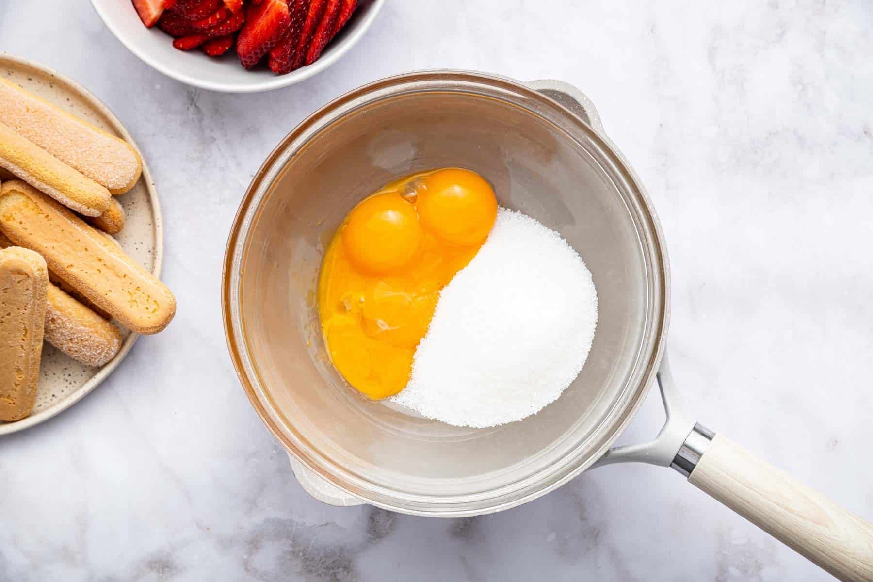 Egg yolks and sugar in a small saucepan.
