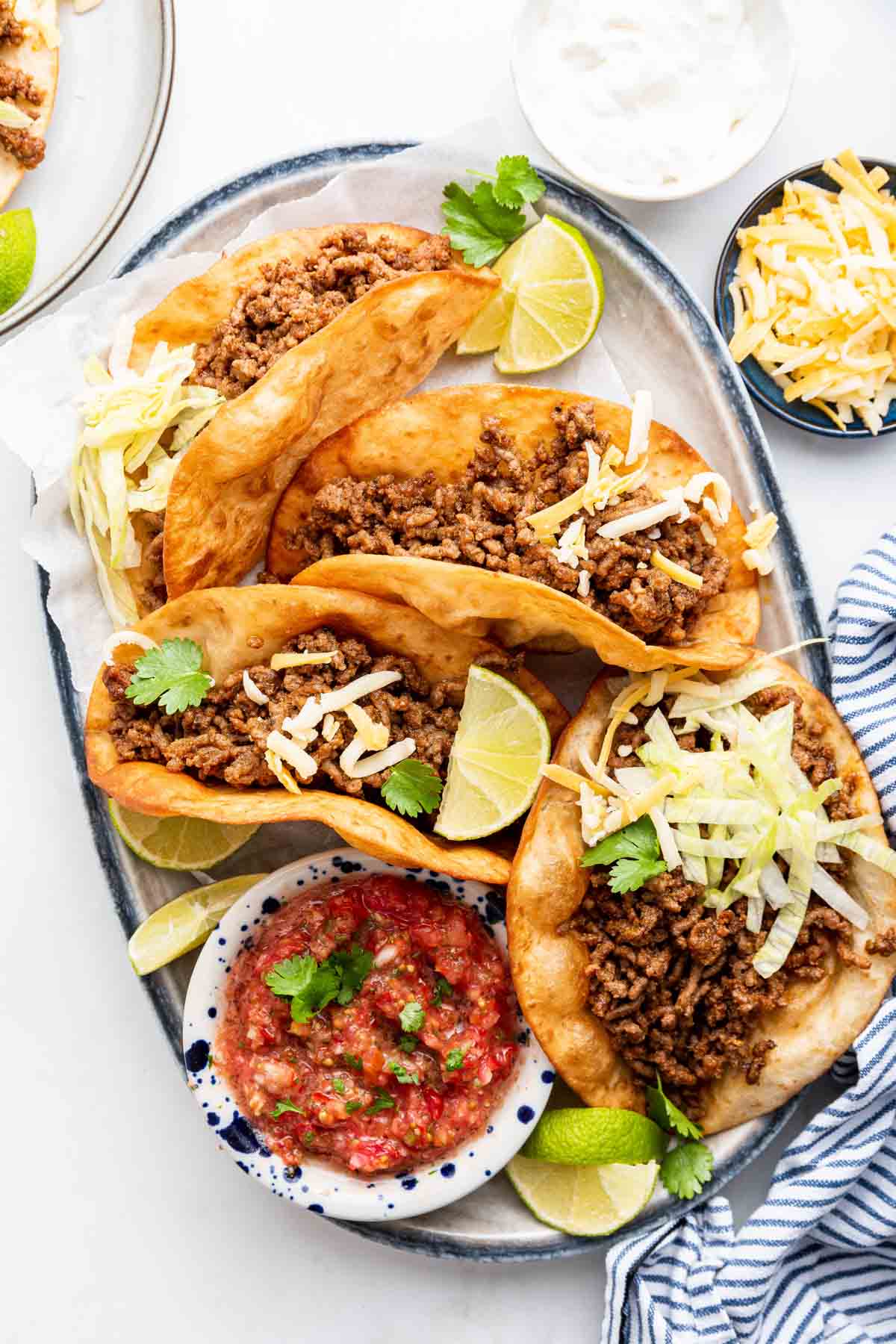 Overhead shot of taco meat on rectangle plate.