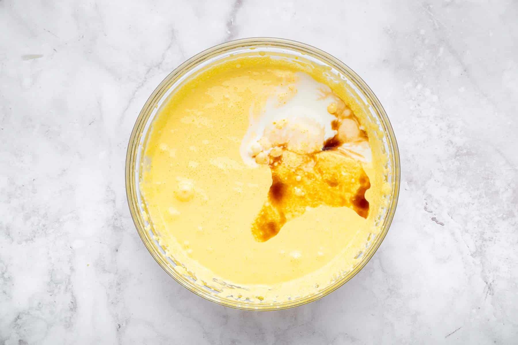 Beaten egg yolks and sugar with a splash of vanilla and cream on top.