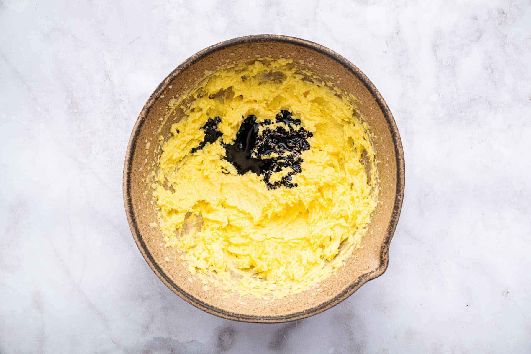 Yellow batter with splash of purple dye in the middle.