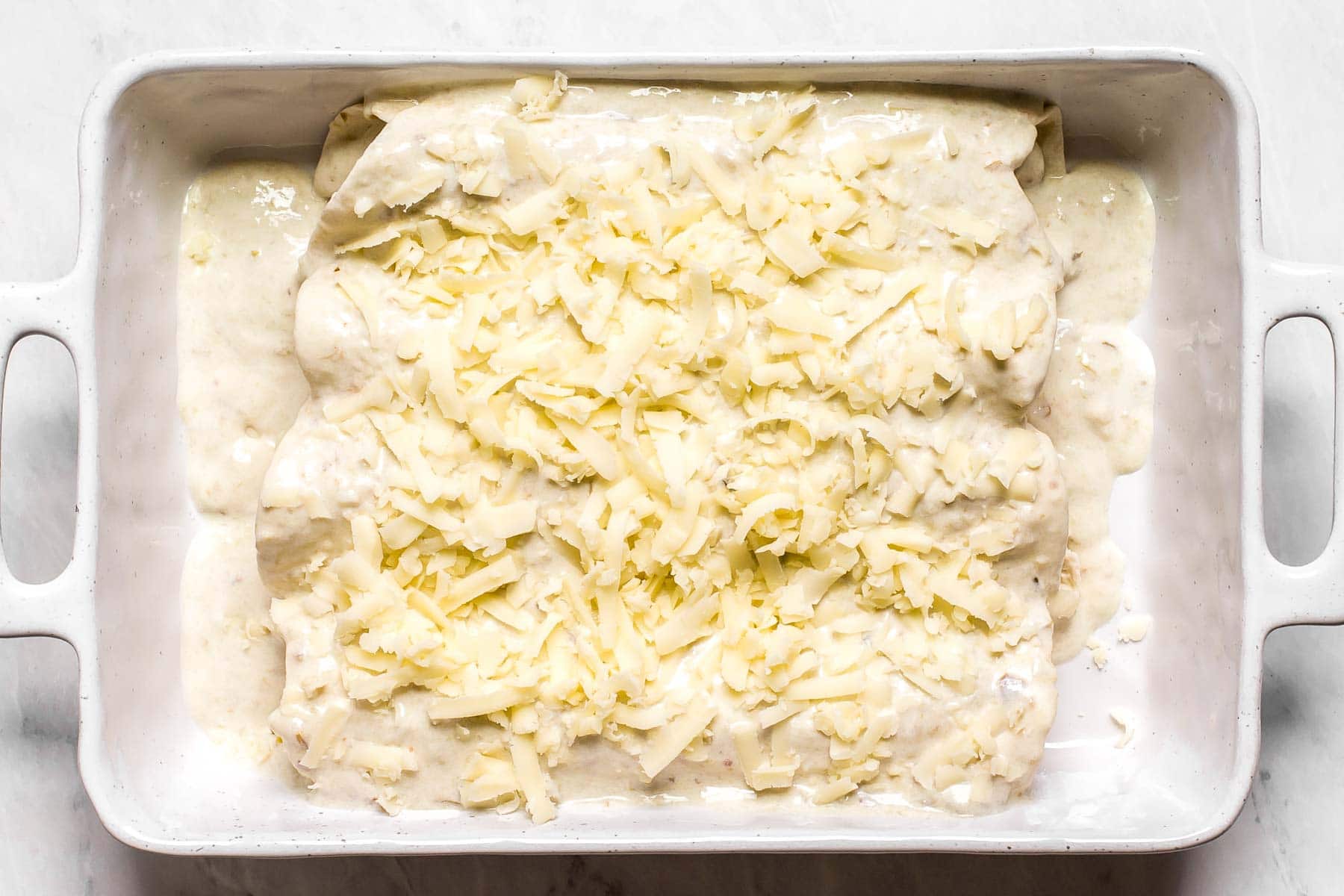 Creamy enchiladas before baking.